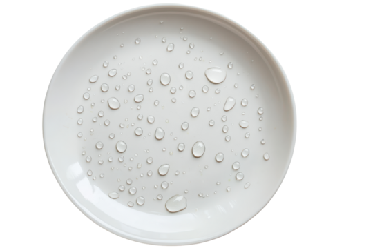 White ceramic plate with water droplets isolated on transparent background. Clean white ceramic plate with scattered water droplets isolated on white background.