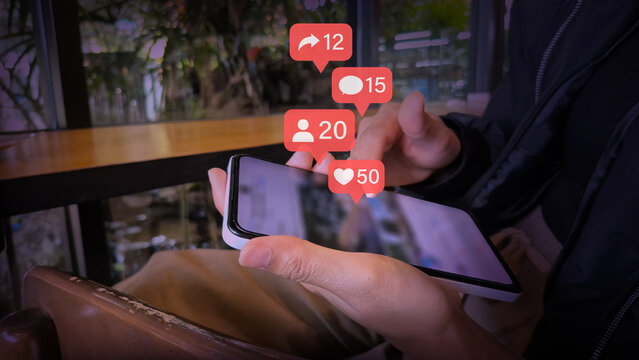 Smartphone with Floating Social Media Metrics in Cafe Environment