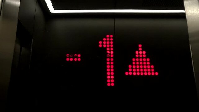 Digital displays showing the office elevators and floors in use in the plaza
