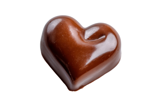 Single heart shaped chocolate with decorative swirls isolated on transparent background. Luxurious heart shaped chocolate with golden swirl design isolated on white background.