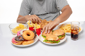 Cropped image, Asian fat man enjoy to eat unhealthy junk food, hamburger and fried chicken.