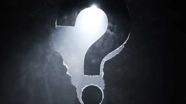 Question mark silhouette in a dark environment with highlight
