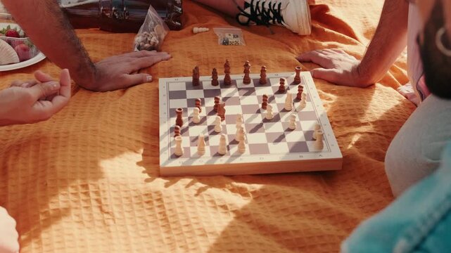 Friends Playing Chess at a Picnic - Powered by Adobe