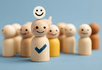 Wooden Toy People with Happy Faces and Checkmark Icons on a Wooden Box. Family group of colorful wooden toy figures on a white background 
