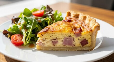 Quiche Lorraine with golden crust, sliced and styled with salad on plate