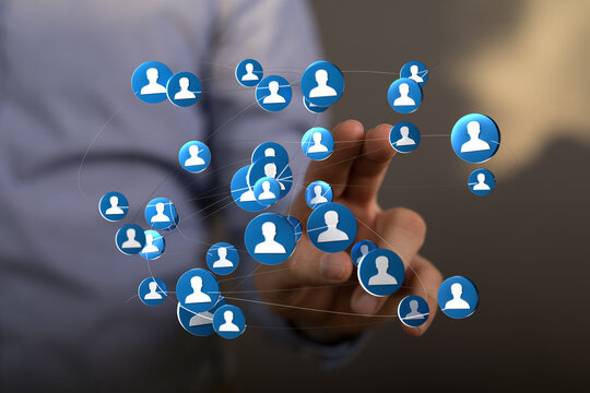 Networking connections concept with hand interacting with digital icons. Representing global business and social media connections. - Powered by Adobe