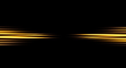 Abstract golden light streaks on a black background