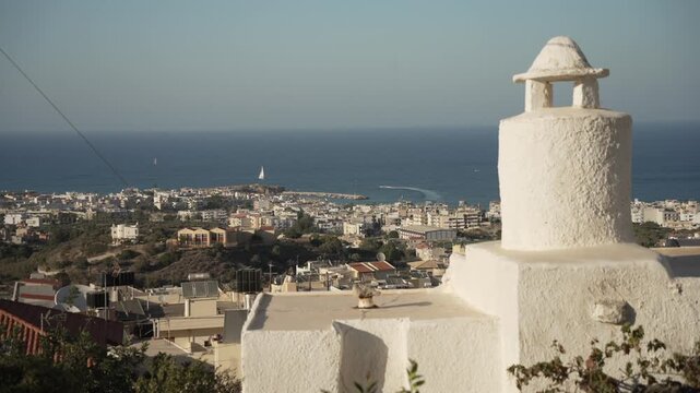 View of Limenas Chersonisou from Piskopiano village on a sunny day, Piskopiano, Crete, Greek Islands, Greece, Europe