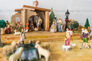 Christmas Nativity scene with figurines of the birth of Jesus, including Mary, Joseph, Baby Jesus,...