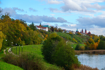 Plock Cathedral and Vistula river embankment in autumn landscape. Plock, Poland