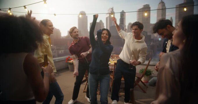 Friends Dance And Laugh At A Rooftop Party, Enjoying Music, Drinks, And City Views. Their Joyful Energy Captures The Spirit Of Weekend Celebration, Friendship, And Urban Nightlife.