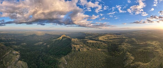 Mountain peak and surrounding landscape under blue sky