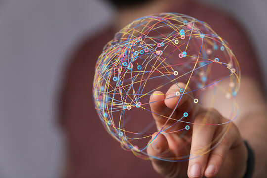 A hand touching a colorful network globe. Illustrating global connection, data transfer, and technology concepts. Ideal for business, IT, and co