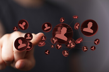 Business networking concept with a finger pressing on a social media connections interface. Digital communication and teamwork visual metaphor.