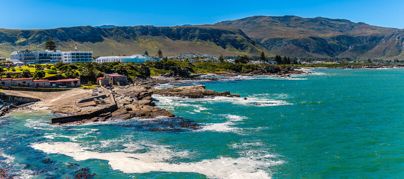 A panorama view past the central promontory down the coastline at Hermanus, South Africa in springtime