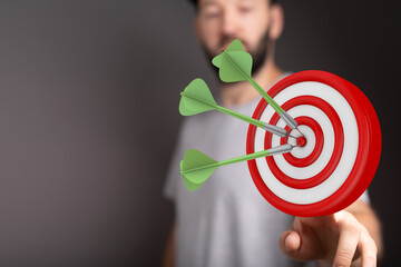 Image of darts hitting a bullseye, symbolizing hitting targets, achieving goals, precision, focus,...