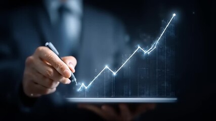 Businessman pointing at a digital growing line graph financial growth - Powered by Adobe