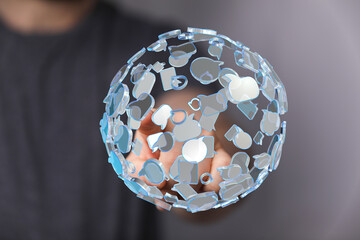 Creative visual depicting global communication and network connections using a digitally rendered sphere composed of speech bubbles,