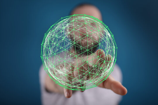 Abstract image depicting a person's hand interacting with a glowing green network globe, symbolizing connectivity, technology, and global data.