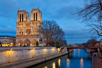 Panoramic view of Notre Dame Cathedral in Paris at night, France