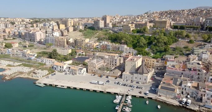 Aerial panoramic view of the town of Sciacca, Sicily, Italy. This village has a small harbor overlooking the crystal-clear waters of the Mediterranean Sea.