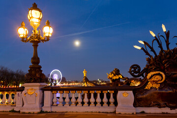 Panoramic view of Pont Alexandre III in Paris at night, France