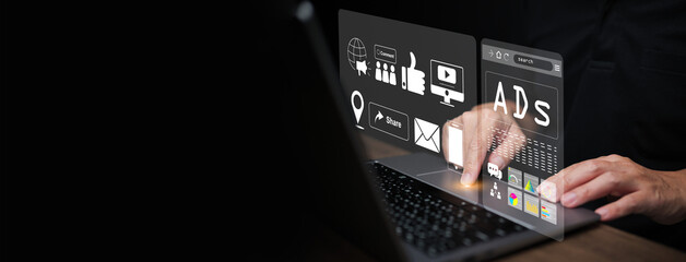 A man using laptop with virtual digital marketing dashboard showing ads, analytics, social media icons, representing online advertising, advertisement technology, business communication strategy.