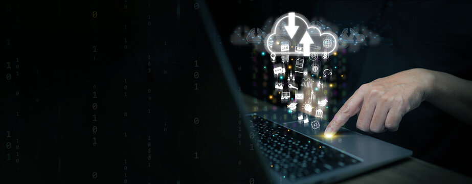 Person using a laptop with glowing cloud computing icons, representing data storage, information sharing, digital network, and online technology innovation.