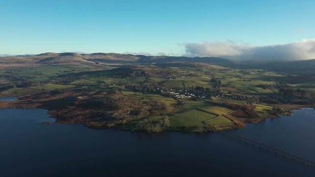 Aerial view of green and brown countryside in Wales on a frosty winter morning