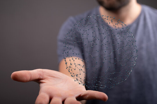 Abstract image of a person holding a digital sphere representing technology, connections, and global concepts. Suitable for business, innovation - Powered by Adobe