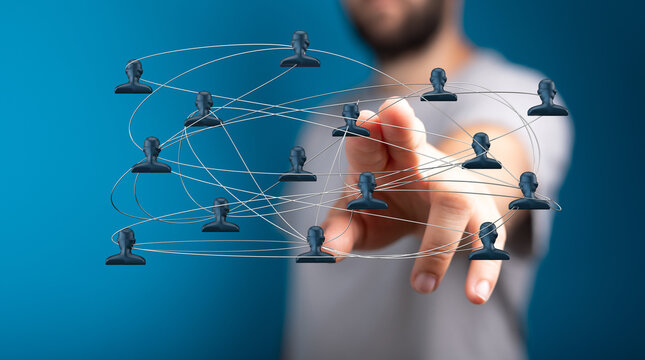 Close up of person touching a network of connected human icons symbolizing social media connections, teamwork, and digital networking on blue ba
