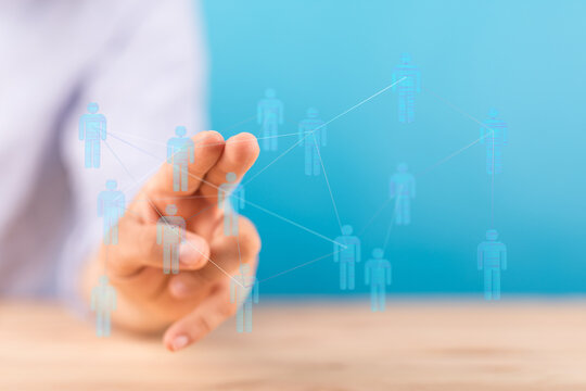 Hand touching digital icons representing connections. Concept of communication, business, and social networking. Teamwork and technology integra