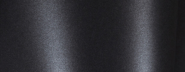 Horizontal black paper background with a luxurious and glossy finish. Features subtle textures of