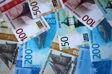 Norwegian Krone currency money bills. NOK currency banknotes in bunch with different denomination close up