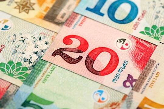 Georgian Lari currency money bills in stack. GEL currency banknotes with different denomination close up