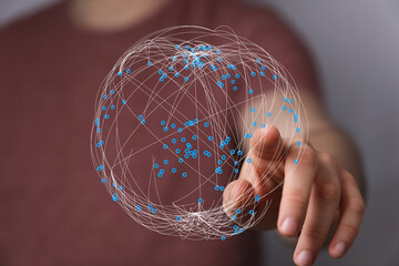 Person interacting with a virtual network sphere. Digital world concept, data connection, global communication, technology, futuristi