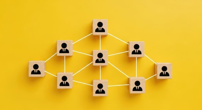 Wooden blocks with person icons connected in a network structure.