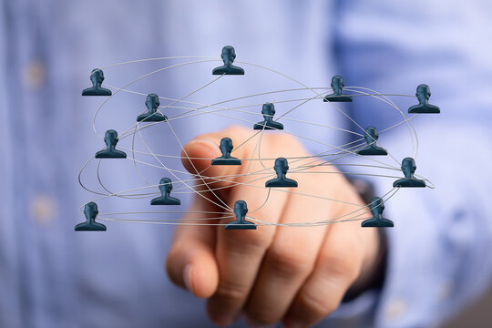 Concept of social network and global connections visualized. Hand pointing to networking of human figures to represent collaboration and the pow - Powered by Adobe