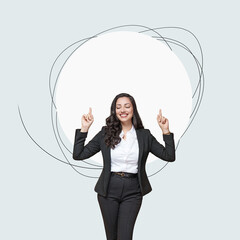  Portrait of a smiling young business woman pointing up , isolated on free background with copy space.