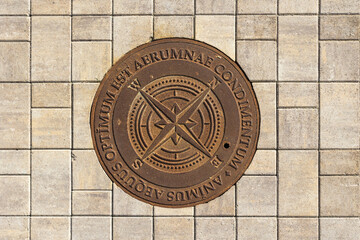 manhole cover on the tiled pavement