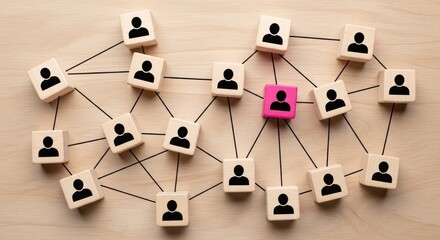 Wooden blocks with person icons connected on light wood surface.