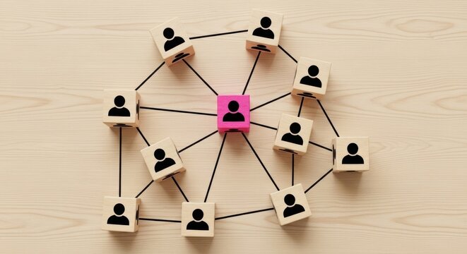 Wooden blocks with person icons connected in a network structure