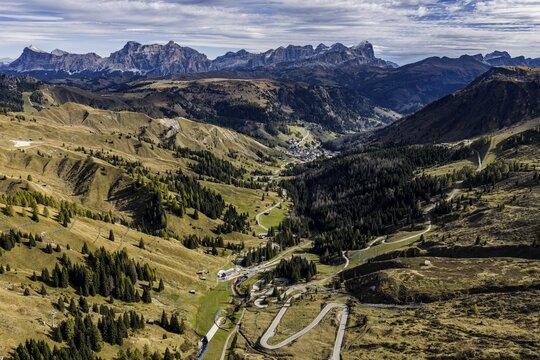 Road, curves, serpentines, pass road, autumn, sunny, Pordoi Pass, view of Tofana Group, Dolomites, Italy