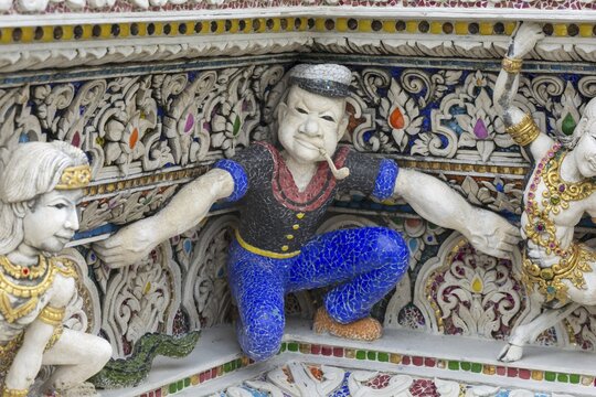 Decorative elements with pop culture references (for example comics, superheroes) in the stucco and porcelain vases outside and inside the art hall with modern art trends such as minimalism and abstraction, Wat Pariwat, Yan Nawa district, Bangkok, Thailand