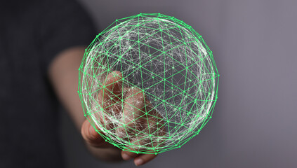 Abstract image of a hand holding a glowing digital sphere. Concept of global network, data...