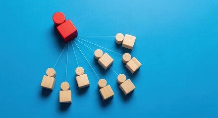 Red block connects to multiple wooden figures on blue background.