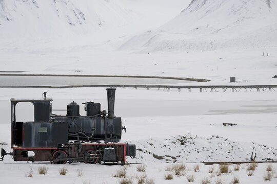 Historic mine railway in winter landscape, Kongsfjord, Ny-&Aring;lesund, Spitsbergen Island, Svalbard and Jan Mayen archipelago, Norway