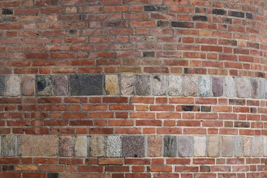 Wall with red bricks and hewn natural stone, Copenhagen, Denmark