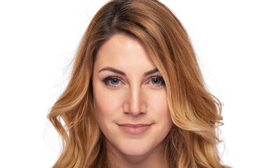 Fototapeta premium A close-up studio portrait of a smiling young blonde woman with natural makeup and wavy hair, looking confidently at the camera on a white background.