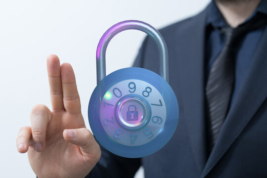 Image depicting cyber security, a businessman holding a padlock representing protection of data and information. Suitable for illustr - Powered by Adobe